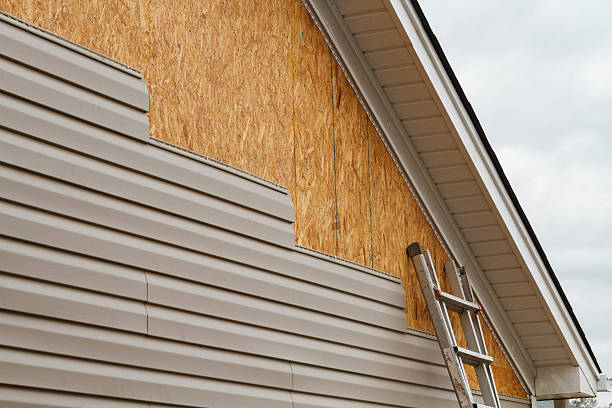 Professional Storm Damage Siding Repair technician working in Williamsport, IN